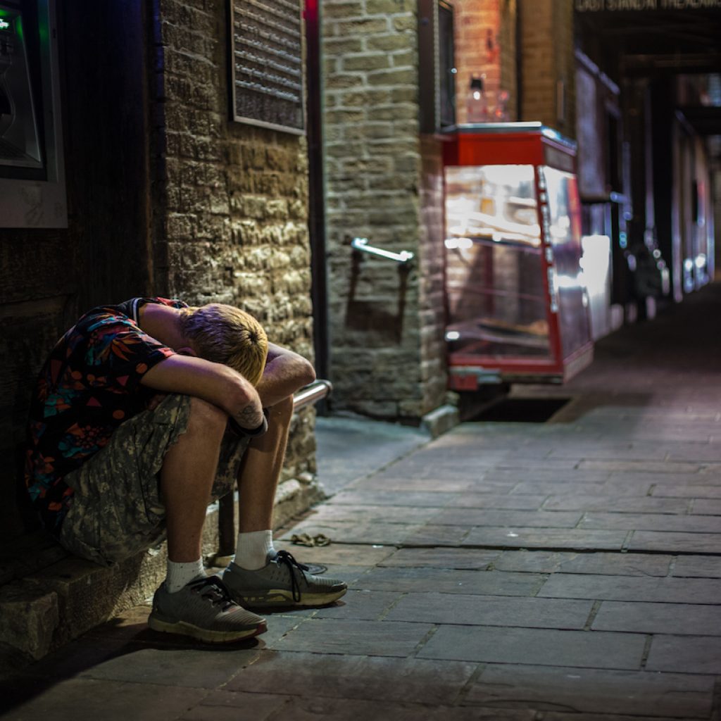 Homeless man sleeps on 6th Street. Austin, 03/24/2020