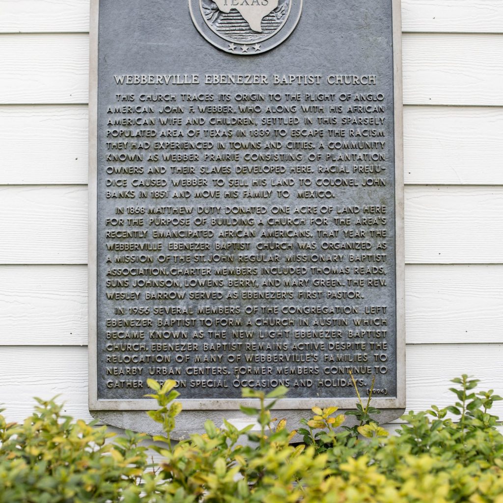 The historical marker at Ebenezer Baptist Church reads “This church traces its origin to the plight of Anglo American John F. Webber, who along with his African American wife and children, settled in this sparsely populated area of Texas in 1839 to escape the racism they had experienced in towns and cities. A community known as Webber Prairie consisting of plantation owners and their slaves developed here. Racial prejudice caused Webber to sell his land to Colonel John Banks in 1851 and move his family to Mexico. “ Full text at the Travis County Historical Commission blog (Photo: Marina Petric)